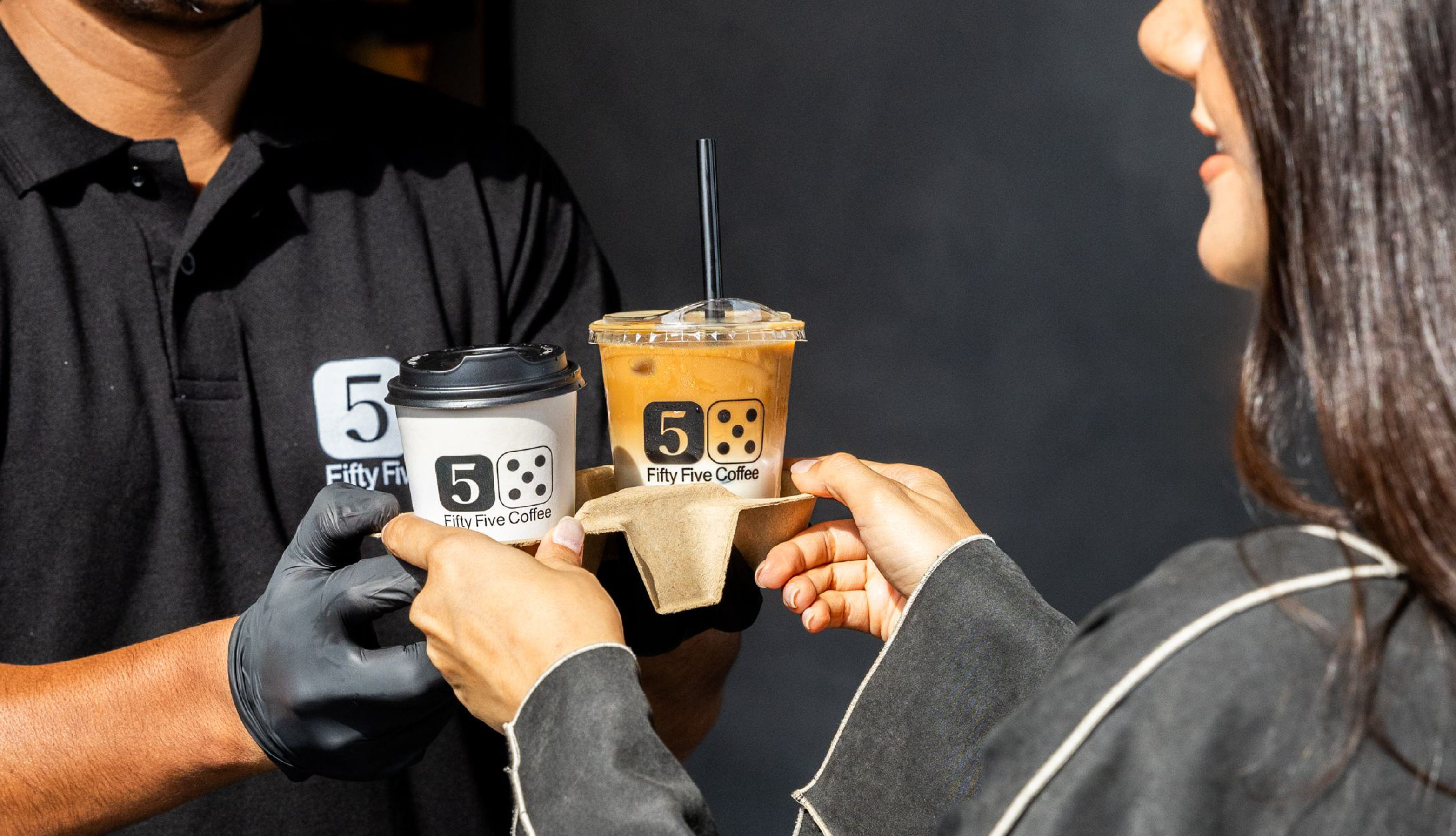 A 55coffee order being handed over