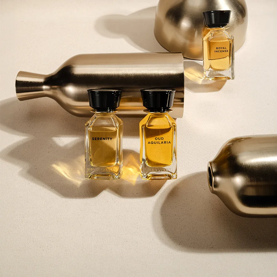 Bottles from the Main Collection with brushed brass vessels