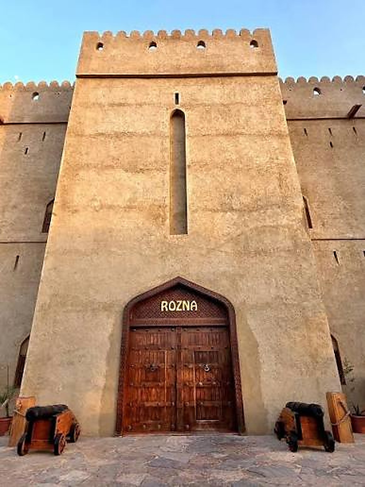 The gate at Rozna: carved teak doors set into the fort wall